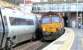 DB Cargo 66099 heads 6K31 Carlisle NY to Rannoch engineers consist North through Motherwell on 9 March 2017. On the adjacent track Pendolino 390119 is heading for London Euston with train 1M17, the 1640 ex Glasgow Central.<br><br>[Ken Browne 09/03/2017]