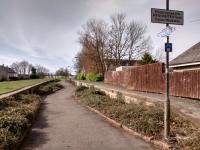 The old platforms at Bonnyrigg, looking south on 24/03/2017. The fake totem is a nice touch; I wonder how many people think it's real and has hung around for 55 years? I would suggest that this spot sees more people a day as a walkway than ever passed through by rail. Today one of those walkers had a black dog called Amber.<br><br>[David Panton 24/03/2017]