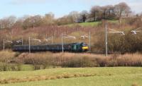 68 020 Reliance approaching Greenfoot Level Crossing with the morning empty coaching movement from Edinburgh Waverley to Motherwell Tmd (9/3/17).<br><br>[Alastair McLellan 09/03/2017]