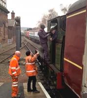 Platform staff and footplate crew confer before the departure of a BLS special from Barrow Hill during an open day on 27 February 2016.<br><br>[Ken Strachan 27/02/2016]