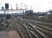 The beginning of the end for the famous signal gantries south of the Joint Station. The new colour light signals were being set up already in Spring 1980 although the power box did not take over until 1981. Aberdeen South Signal Box is in the centre of the photo.<br>
The train approaching is an SRPS railtour set destined for Dufftown hauled by 27010 [see image 59220] Members of the Aberdeen University Railway Society joined the train here.<br><br>[Charlie Niven 31/05/1980]