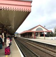 Waiting for a train. Looking along platform 1 at Aviemore station on 26 April 2017. Just arriving from the north is the ScotRail 1551 Inverness - Edinburgh.<br><br>[Andy Furnevel 26/04/2017]