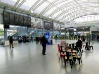 Cafe society: a look across the concourse at Haymarket on 24/04/2017. It's easy to forget that until a few years ago Haymarket's 'circulating area' was the in the original 1842 building which now acts as sort of vestibule. The white building on the other side of the tracks is over 100 years older than that. Easter Dalry House was once a mansion in open countryside ...<br><br>[David Panton 24/04/2017]