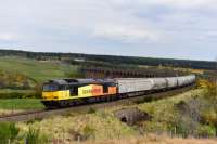 Colas Rail Freight liveried 60096 leaves Culloden Viaduct with the southbound cement empties. One cargo wagon and ten Tarmac cement tankers.<br><br>[John Gray 01/05/2017]