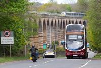All roads lead to Gorebridge. The Lothian no 29 bus ex-Silverknowes has just turned off the A7 heading for Main Street, Newtongrange on the morning of 7 May 2017. Meantime, in the background, the ScotRail 1011 ex Waverley has appeared at the north end of Newbattle Viaduct. The bus will eventually terminate at Gorebridge, while the train will call there on its way to Tweedbank.<br><br>[John Furnevel 07/05/2017]