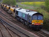 DRS-liveried but Freightliner-owned and branded 66413 draws a Craiginches South - Millerhill ballast out of Inverkeithing Up Loop on 25 April.<br><br>[Bill Roberton 25/04/2017]