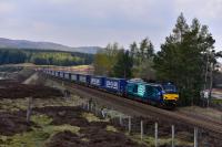 The southbound containers for Mossend head out of Dalwhinnie hauled by 68023 Achilles.<br><br>[John Gray 03/05/2017]
