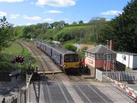 On 22 April 2017, the 13.43 service from Barnstaple to Exeter and Exmouth halts briefly at Crediton signal box to return the single-line token from Eggesford to Crediton to the signaller. The single line from Barnstaple to Crediton - originally engineered for double-track throughout, but never fully doubled - now has just one passenger loop, at Eggesford, where drivers exchange tokens with the signaller from platform cabins, using the 'No Signaller Token Remote' system, which is low-cost but time-consuming.<br><br>[David Spaven 22/04/2017]