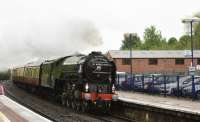 A1 60163 Tornado, westbound through Hungerford on a wet and windy 17th May 2017, heading for Bristol Temple Meads with the Belmond British Pullman stock.<br>
<br><br>[Peter Todd 17/05/2017]