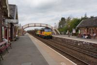 Colas 60080 thunders through Appleby with the Carlisle to Chirk timber train on 10th May 2017. This train has a path to run either via the S&C or over Shap. I nearly missed it as I was browsing in the station bookshop but heard it approach and managed a shot.<br>
<br><br>[Bruce McCartney 10/05/2017]