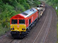 DB red liveried 66206 is on the rear of the 6K50 Millerhill - Elgin rail train on 20th May 2017. The train is passing Dalgety Bay with lead locomotive 66117 out of sight beyond the bend [See image 59300].  <br><br>[Bill Roberton 20/05/2017]