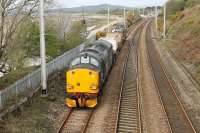 DRS 37609 brings up the rear of a two flask train from Heysham to Sellafield on 5th April 2017. The train is running along the chord from Bare Lane approaching Hest Bank with classmate 37218 leading. <br><br>[Mark Bartlett 05/04/2017]