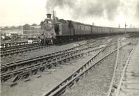 A Milngavie bound train runs through Kelvinhaugh Junction on 28 May 1957 behind Eastfield shed's ex-NBR C16 4-4-2T no 67500.<br><br>[G H Robin collection by courtesy of the Mitchell Library, Glasgow 28/05/1957]