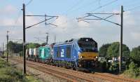 <I>Fresh from the boat</I>. Newly imported DRS 68026 was used on the Crewe Sellafield flask train on Saturday 3rd June 2017. Paired with 68001 <I>Evolution</I> the pair are seen heading north at Brock. 68026 is intended for TPE passenger services and the different (temporary) livery is very noticeable.<br><br>[Mark Bartlett 03/06/2017]