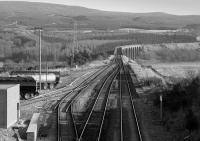 Looking south over Culloden Moor goods yard towards the viaduct.  I think the bitumen traffic had ceased. (Can anyone confirm the closure date?)<br><br>[Bill Roberton 31/03/1989]