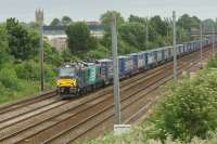 DRS 88003 heads north between Leyland and Farington Jct with the Daventry to Mossend 'Tescoliner' on 12 June 2017. This was the first northbound working on this container service with one of the new Class 88 locomotives.<br><br>[John McIntyre 12/06/2017]