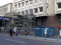 A modest piece of scaffolding has been erected near the Dundas Street entrance. According to Network Rail, this is part of phase one – a 'soft strip' of Consort House ahead of the main project works involving the demolition and redevelopment of Queen Street Station.<br><br>[Colin McDonald 11/06/2017]
