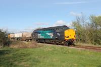 With new DRS locos being delivered in 2017 the days of the Class 37 fleet are perhaps numbered. Almost looking like it is posing for its picture, EE Type 3 37069 brings up the rear of a Heysham to Sellafield flask train using the single track Bare Lane to Hest Bank chord on 12th April. Lead loco was classmate 37059.<br><br>[Mark Bartlett 12/04/2017]