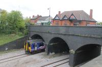 A Blackpool North to Huddersfield service passes over newly relaid tracks as it slows for the Poulton stop on 6th May 2017. The station ticket office and main entrance can be seen on top of the bridge. Catenary will be erected here during the next twelve months.<br><br>[Mark Bartlett 06/05/2017]