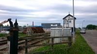 Forres East Signal Box, looking east. The box looks out on a large pile of new sleepers - part of the scheme which will soon see it superfluous and swept away. <br>
<br><br>[Alan Cormack 21/06/2017]