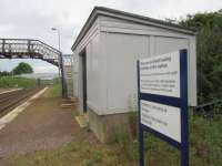 The timber shelter at Breich alongside the low platforms and the aged footbridge, whose need for replacement has prompted the decision to seek approval for closure. <br><br>[John Yellowlees 27/06/2017]