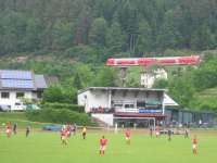 Players and spectators at the SV Hornberg v. SV Hausach football match<br>
are oblivious to the passage of a northbound Schwarzwaldbahn RE service on<br>
3rd June 2017.<br>
<br><br>[David Spaven 03/06/2017]