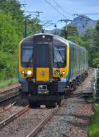 FTPE 350404 approaches Kingsknowe with the 12.13 Edinburgh - Manchester Airport service on 3 July (... almost an Alpine feel?)<br><br>[Bill Roberton 03/07/2017]