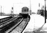 A DMU from Sheffield arrives at the Huddersfield bound platform at Penistone on a bright and sunny autumn afternoon in 1978. The Woodhead route runs through the platforms off to the right. <br><br>[John Furnevel 12/09/1978]