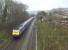 The 15.23 to Paddington (time from Bath Spa) is about to pass Oldfield park at speed. Photo' taken from road bridge adjacent to the S&D trackbed. [See image 58426]<br><br>[Ken Strachan 05/03/2017]