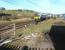 The remains of Beattock station looking north through the Network Rail access gate on 27 March 2017. The approaching train is the 0906 First TransPennine Express Glasgow Central - Manchester Airport.<br><br>[John Furnevel 27/03/2017]