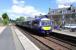 A through service to Glasgow pulls into Platform 1 at Dunblane while the ex-Edinburgh train waits in the reversing stub to replace it and return to the capital. The Edinburgh train had arrived in Platform 3 (left). These manoeuvres may seem a little unnecessary when Platform 3 is off the main line, but the<br>
Platform 3 track has no southbound connection with the up line. Platform 1<br>
is also more accessible for passengers.<br>
<br><br>[David Panton 18/05/2017]