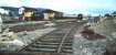 The Up <I> Clansman </I> pulling into Aviemore in summer 1979 passes a Speyside Railway train waiting at the Aviemore Speyside platform.  The former Longmorn Station footbridge was being rebuilt as was the former Dalnaspidal Station building. A Class 26 loco sits in a siding below Aviemore SB awaiting its next duty. <br><br>[Charlie Niven //1979]