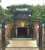 By contrast to the main entrance on the south side, the north entrance to Carrickfergus station is via a subway, seen here on 13 June 2017. The roof of the main building can be seen beyond the platforms.<br><br>[Andy Furnevel 13/06/2017]