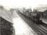 Stranraer based Fowler 2P 4-4-0 no 40623 pulls into the westbound platform of New Galloway station on an overcast Saturday 14 July 1956 with a Dumfries - Stranraer stopping train.<br><br>[G H Robin collection by courtesy of the Mitchell Library, Glasgow 14/07/1956]