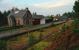 Dava looking north from the southbound platform early in 1994. The trackbed has overgrown somewhat since. The stations at Grantown, Dava and Dunphail had extremely long platforms and long loops, which give away that these were former mainline stations. A signalman acquaintance worked there, I asked him what he recalled of it; the smell of peats burning, drifting out over the station, long cold winter silences between trains and bright stars.<br><br>[Ewan Crawford //1994]