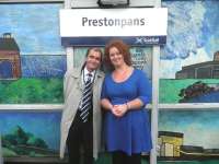 The new mural by Adele Conn was officially inaugurated at Prestonpans station on 2 October 2011 by Councillor Willie Innes. The photograph shows Councillor Innes with Adele Conn in front of the completed work (refer previous news item dated 18 September 2011). [See image 34627].<br><br>[John Yellowlees 02/10/2011]