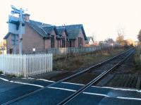 The former Inverness & Ross-shire 1862 station at Bunchrew looking east towards Inverness over the open level crossing in November 2003. The station was closed to passengers in June 1960.<br><br>[John Furnevel 24/11/2003]
