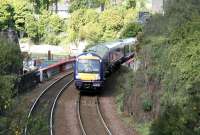 A Fife Circle train rounds the curve on the southern approach to Burntisland station on a sunny May morning in 2005.<br><br>[John Furnevel 26/05/2005]