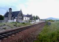 Looking north at Newtonmore in May 2002. The station building has been sold, the loop lifted, the remaining operational platform repositioned and a shelter erected. [see image 32328]<br><br>[John Furnevel 09/05/2002]