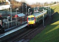 A southbound service enters the wholly new station at Merryton.<br><br>[Ewan Crawford 12/12/2005]