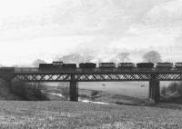 Looking north towards the Ochil Hills west of Tillicoultry on a misty morning in the autumn of 1971. A Clayton Type 1 locomotive is crossing Glenfoot Viaduct over the River Devon at the head of a Dollar - Alloa coal train [see image 3628].<br><br>[John Furnevel 07/10/1971]