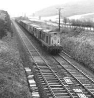 EE Type 1 8098 with a northbound freight running parallel with the A76 at Mennock on the GSWR main line south of Sanquhar in October 1970.<br><br>[John Furnevel 26/10/1970]