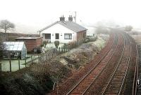 A pair of former surfacemens' cottages near the site of Auldgirth station (behind the camera) looking south through the mist towards Dumfries in January 2006.<br><br>[John Furnevel 31/01/2006]