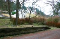 Southern end of the platform at Victoria Lodge in February 2006, with the branch to the top of the dam continuing its climb along the line of the wall centre left.<br><br>[John Furnevel 01/02/2006]