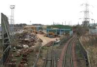 VAE Baileyfield Switch & Crossing Works, Portobello, looking along the branch from South Leith in February 2006. Running across the centre of the picture beyond the main shed is a class 66 heading south along the ECML with the morning Powderhall - Oxwellmains <I>Binliner</I> containers.<br><br>[John Furnevel 07/02/2006]