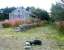 The abandoned former station at Grantown-on-Spey East. View north east along the trackbed towards Craigellachie in September 2004.<br><br>[John Furnevel 17/09/2004]