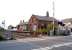 Looking across Station Road level crossing to Bedlington Station on 25 May 2004, looking north east from alongside Bedlington South signal box.<br><br>[John Furnevel 25/05/2004]