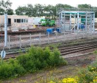 Work in progress in the area around the train washing plant at the new Millerhill EMU depot. View east across the freight lines on 16 July 2017, with the new depot located beyond the fence.<br><br>[John Furnevel 16/07/2017]