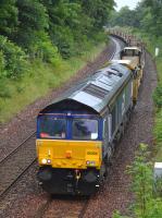 DRS 66304 nears Dalgety Bay with an Aberdeen - Millerhill empty CWR train on 9th July 2017. 66305 is just visible on the rear.<br>
<br><br>[Bill Roberton 09/07/2017]