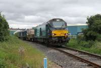DRS 68022 <I>Resolution</I> swings on to the Heysham branch after reversing at Morecambe and heads for the power station with a single flask wagon and classmate 68029 in tow. Image taken on 29th June 2017 from behind the fence at the improved foot crossing for the cycleway to Lancaster along the old Green Ayre trackbed. [See image 51941] taken from the same spot two years earlier with classic traction in use.<br><br>[Mark Bartlett 29/06/2017]